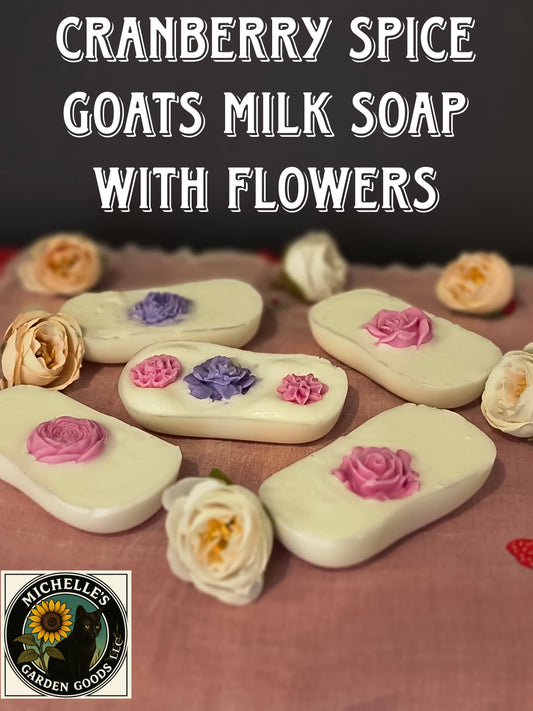Cranberry Spice Goats Milk Soap Bars With Flowers 
Ingredients:
Goats Milk Soap Base, Snapdragon Almond Oil, Vitamin E, Mica Powder and Cranberry Spice Fragrance. 
All soap bars come with a Loofah Soap Bag
2.70 Oz.