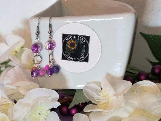 Purple Glass Cracked Dangling Beaded Earrings / Silver color
Dimensions H 2" x L 0.625" x W 0.375". Weight 0.15 Oz.