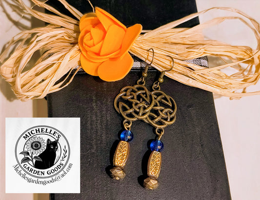 Chinese Trinity Knot With Blue Glass Beaded Earrings. 
Hypoallergenic material: Alloy, Brass, Iron, Glass, cadmium Free & Nickel Free & Leaf Free.
Dimensions H 2.875" x L 0.875" x W 0.25". Weight 0.22 Oz.