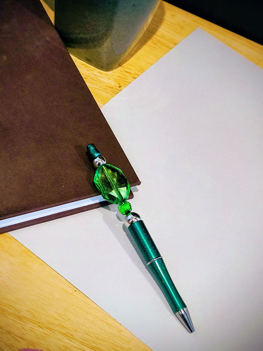 Be The Talk Of The Office With These Colorful Decorative Ballpoint Pens. Each Pen comes with an extra ink cartridge. This is a Emerald Green Beaded Decor on a Green Ballpoint Pen.
Dimensions 5.75" x .5" x .5". Weight 0.49 Oz.