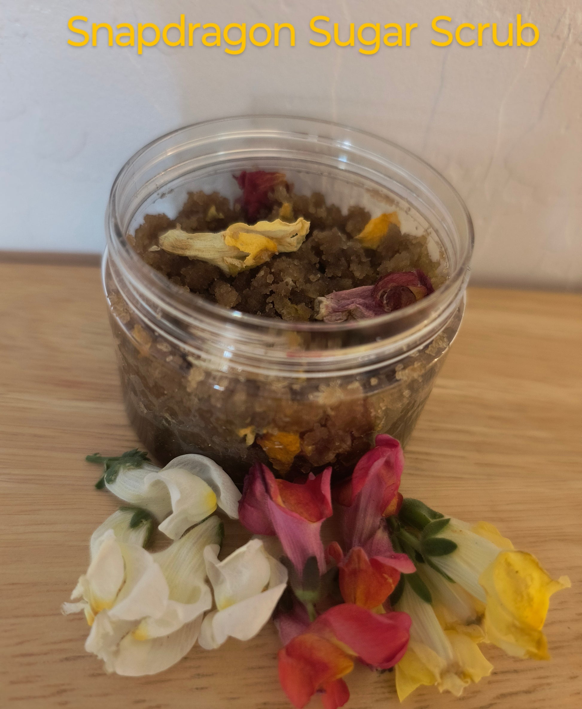 This Scrub Is Great for Sensitive Skin with The Brown Sugar. The Snapdragon Flowers With The Almond Oil Gives it a Almond Pastries Smell. 
Ingredients: Snapdragon Flowers Infused with Jojoba Oil and Almond Oil. Brown Sugar, Arrowroot powder and dried snapdragon flowers.  
Dimensions H 2.75" x L 2.75" W 2". Weight 4 oz.