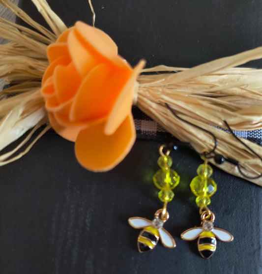 Yellow Glass Beaded Earrings with Bees With Black Hooks
Dimensions H 2" x L 0.625" x L 0.315". Weight 0.13 Oz.