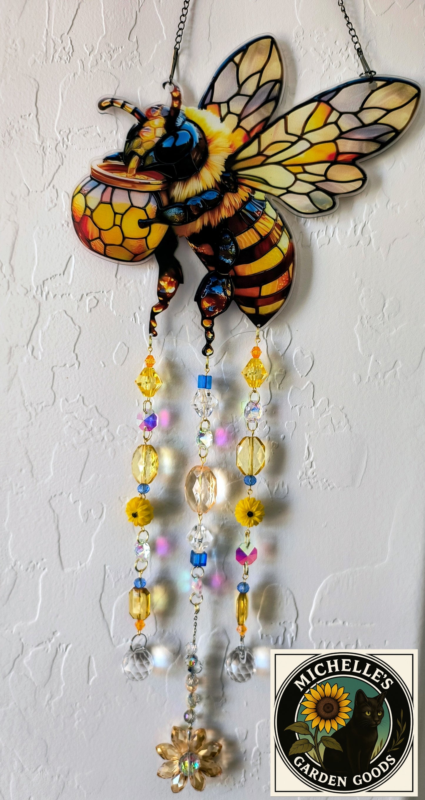 Bee Suncatcher 2D Acrylic With Crystal and Handmade Beads. This Adorable Bee Suncatcher will make The Room Explode in Prism Lights with it's Crystal Beads. Great for the Home or office Window or in the Garden.
Dimensions 19" x 7" x 1 mm. Weight 4.7 Oz.