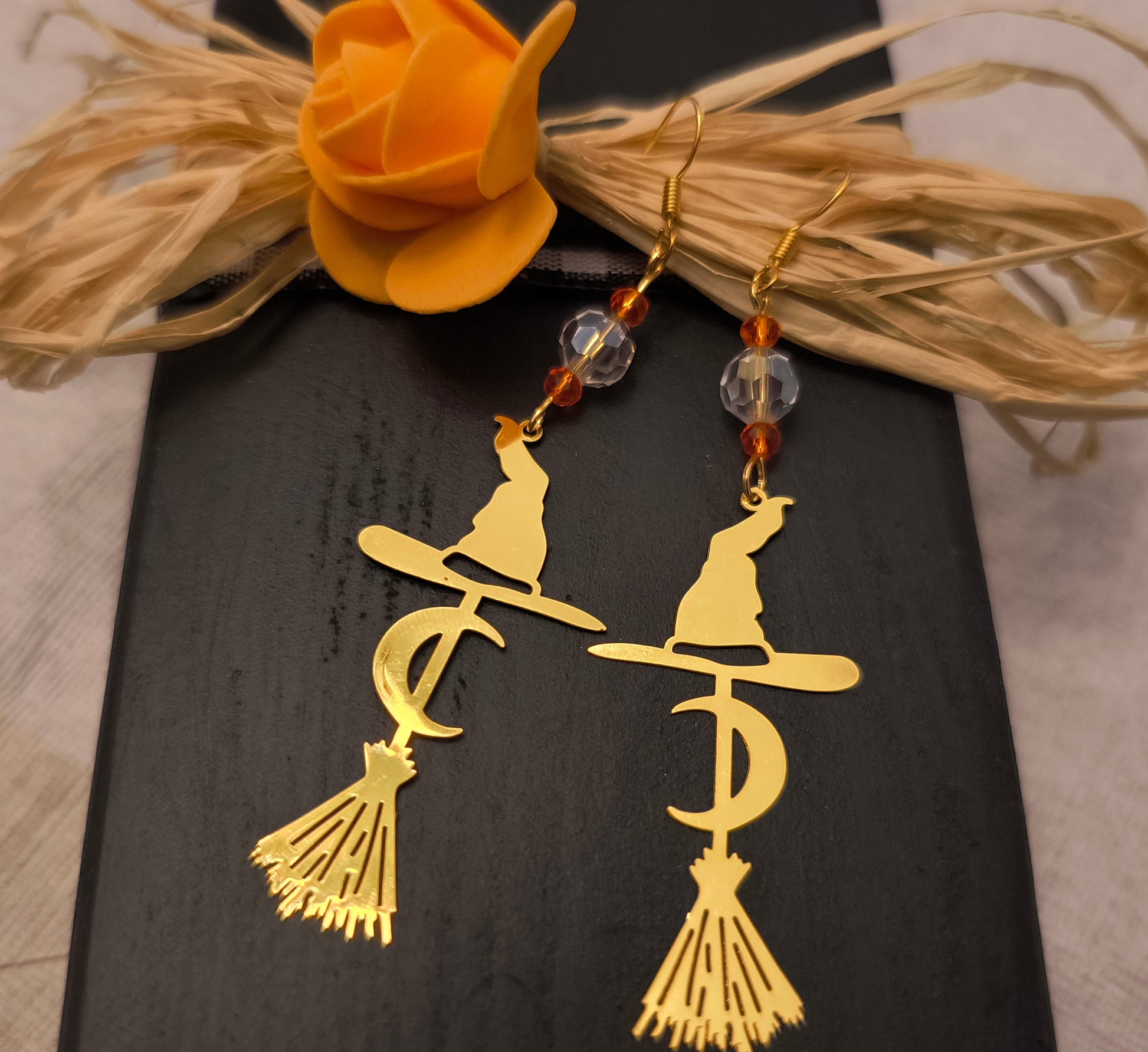 Red And Crystal Glass Beads with Large Witch Hat and Broom Earrings / Gold color
These are perfect for Fall or Halloween 
Dimensions H 3.5" x L 1" x W .25". Weight 0.15 Oz. 