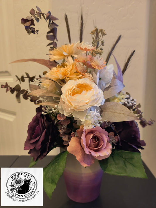 Bouquet of Purple, Pink and Beige Roses in a multi Purple Colored Ceramic Vase.