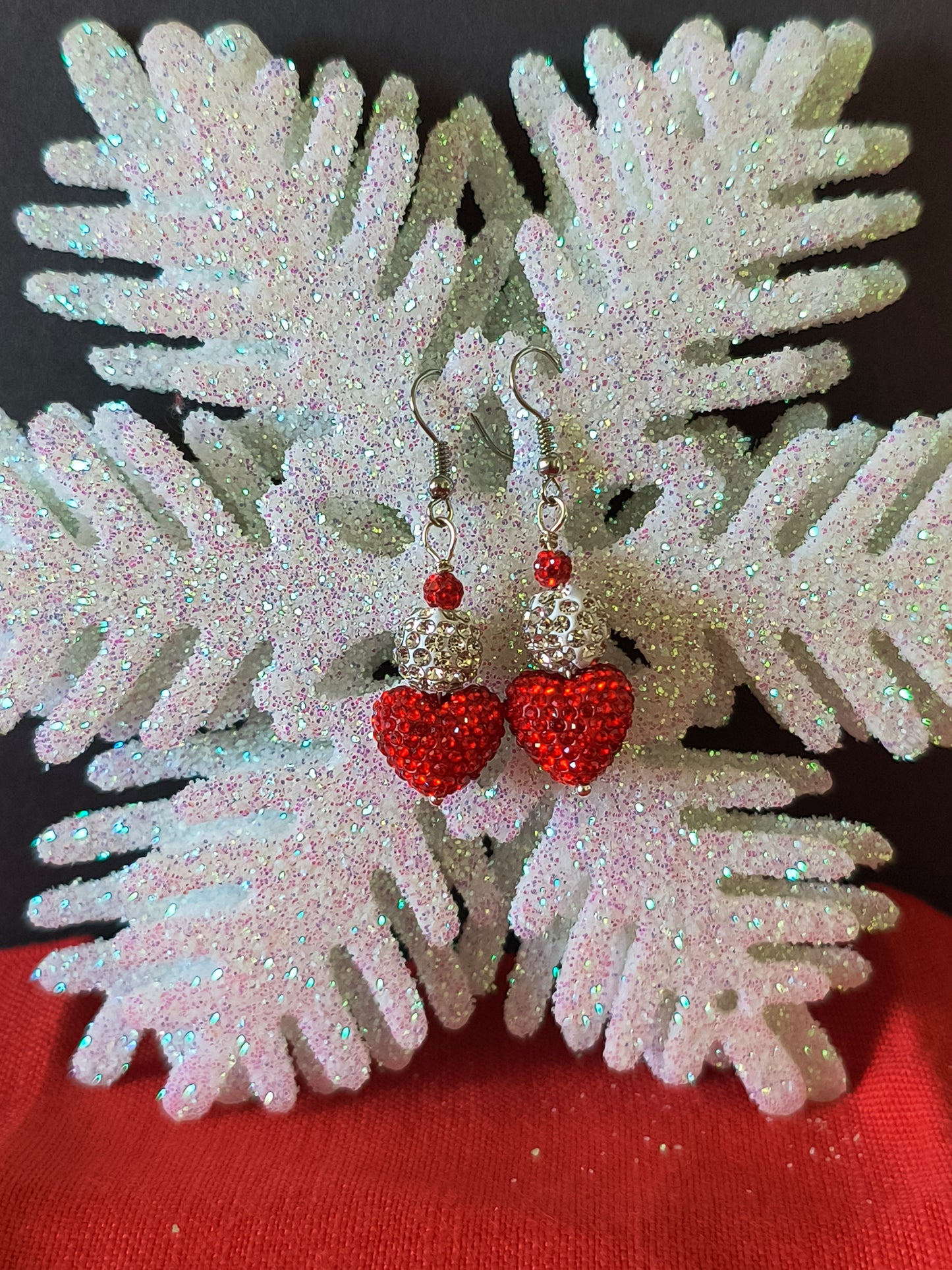 Sequin Silver and Red Heart Earrings
Adorn your ears with these Red Hearts that catch the light with every turn, adding instant glamour to your evening wear.