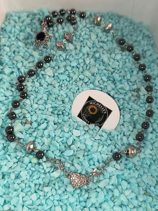 This Handmade Hematite Necklace With A Sapphire Turtle Charm. Held together by a Rhinestone Magnetic Heart
2 In 1 Design using the Heart Clasp or the Turtle Charm
Dimensions H 11" x L 0.625" x W 0.5". Weight 1.04 Oz.
