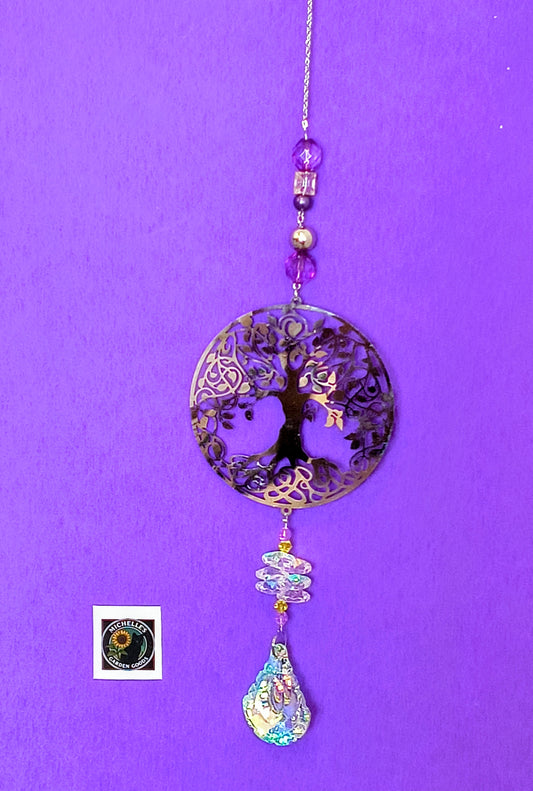 The Giving Tree Single Strand Suncatcher with Crystal Beads 
Single Strand Suncatcher With The Giving Tree in Purple Glass and Crystal Beads. This is a Sparkling Piece to Hang in the Garden or Home for Decor.
Dimensions 10.5" x 4" x 1 mm. Weight 1.51 Oz.