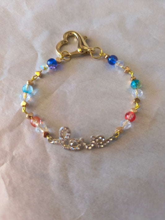 Bracelet Rainbow Cracked Beads with Tiny Gold Hearts combined with a Love Rhinestone Charm