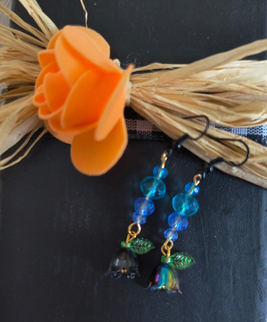 Blue Glass Beads With Flower and Petal Earrings / Black

Dimensions H 2" x L 0.5" x W 0.5". Weight 0.11 Oz.
