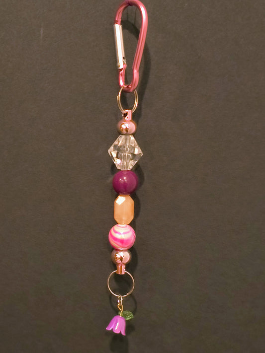 This Cute Decorative Beaded Keychain Will Brighten Up Your Drive. It Can Always Help You Find Your Keys With All The Pretty Glass And Acrylic Beads.

Dimensions .6.5" x 1.5" x .5". Weight 0.53 Oz.