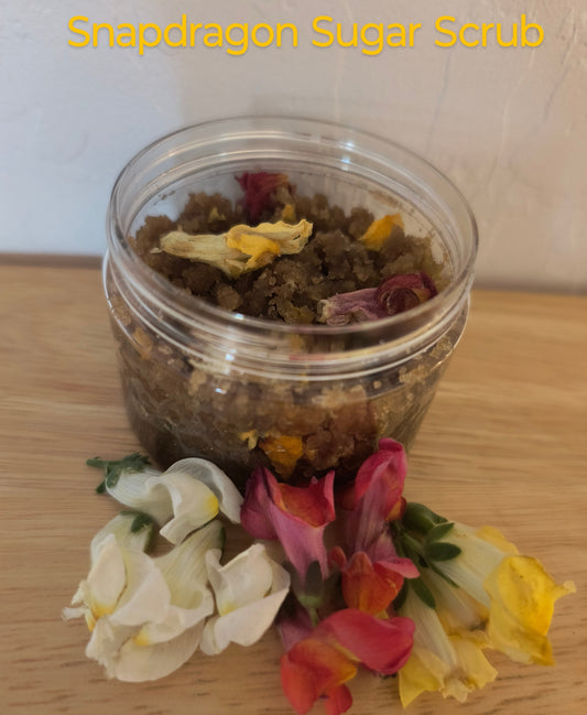 This Scrub Is Great for Sensitive Skin with The Brown Sugar. The Snapdragon Flowers With The Almond Oil Gives it a Almond Pastries Smell. 
Ingredients: Snapdragon Flowers Infused with Jojoba Oil and Almond Oil. Brown Sugar, Arrowroot powder and dried snapdragon flowers.  
Dimensions H 2.75" x L 2.75" W 2". Weight 4 oz.