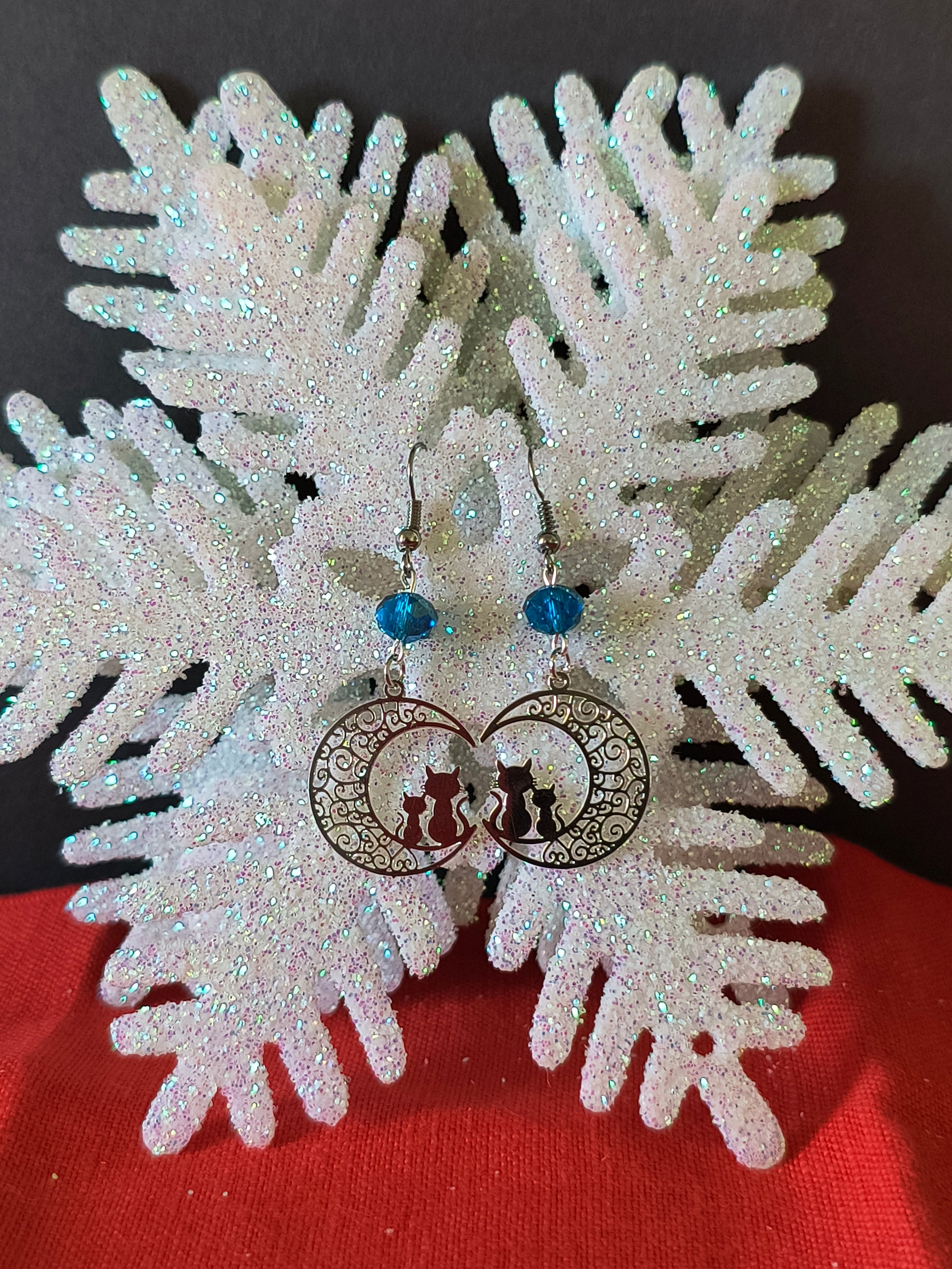 Silver Crescent Moon Cat Filigree Earrings with Blue Transform your look with the perfect pair.