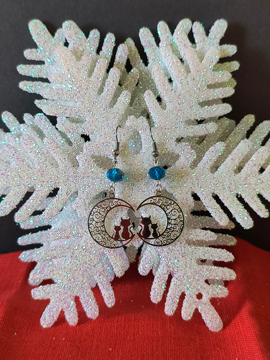 Silver Crescent Moon Cat Filigree Earrings with Blue Transform your look with the perfect pair.