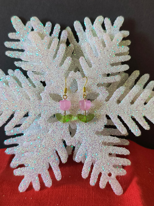 Pink Tulip Earrings with Leaf in a gold color

Transform your look with the perfect pair.