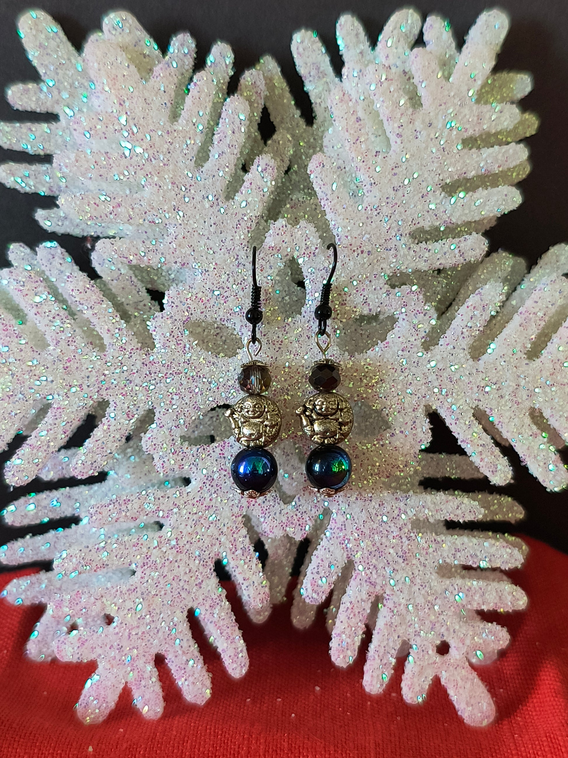 Silver Budda with Rainbow Obsidian Beaded Earrings

Adorn your ears with these cascading drops of good luck and fortune that catch the light with every turn, adding instant glamour to your evening wear.